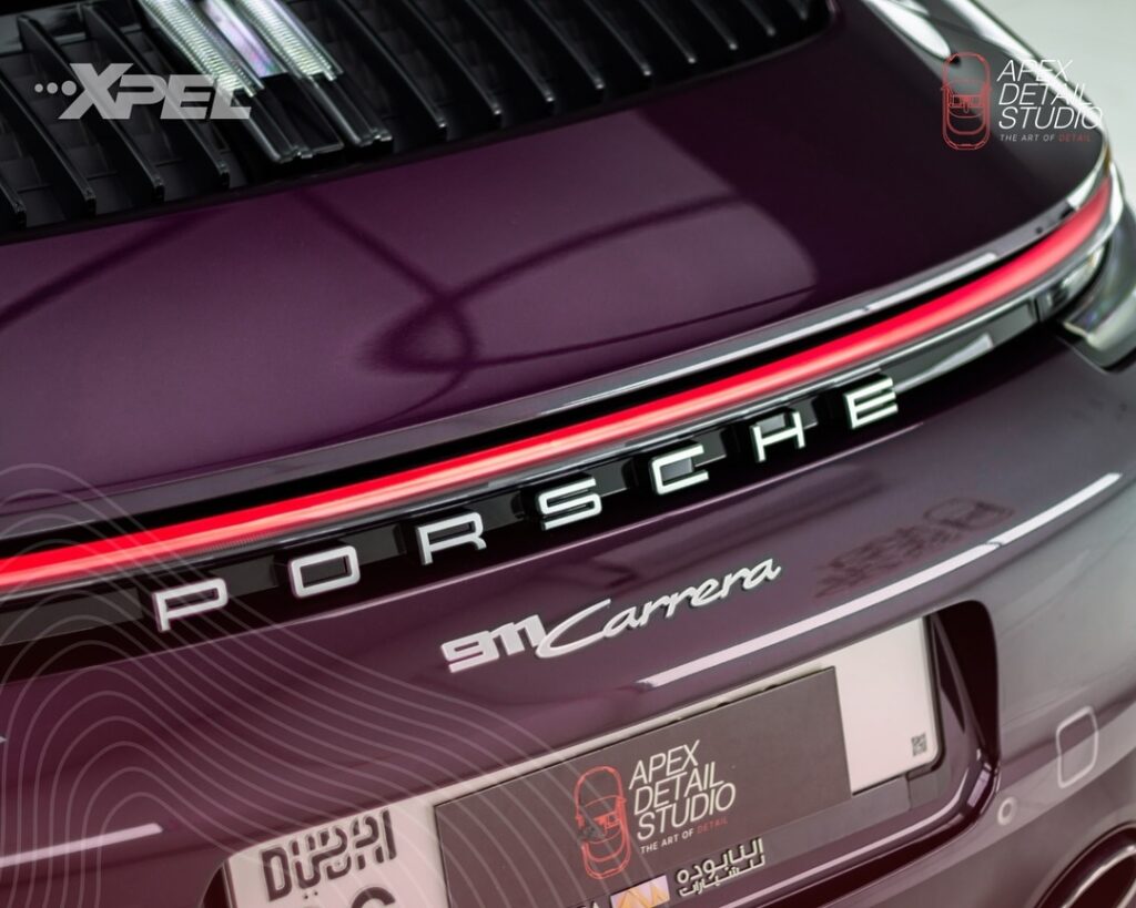 Porsche 911 Carrera receiving a meticulous XPEL Ultimate Plus Protection Film application by Apex professionals.