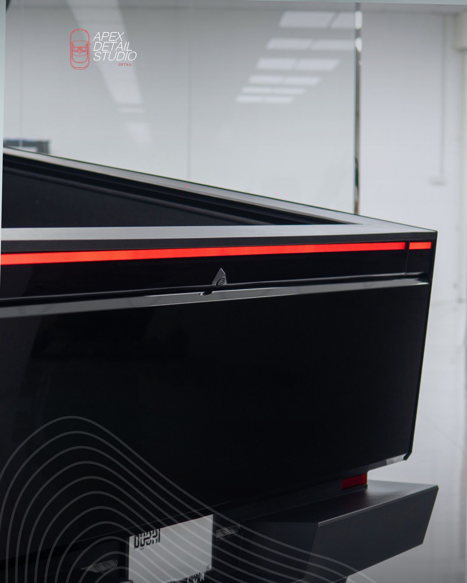 Rear light bar of a black Tesla Cybertruck at Apex Detail Studio Dubai