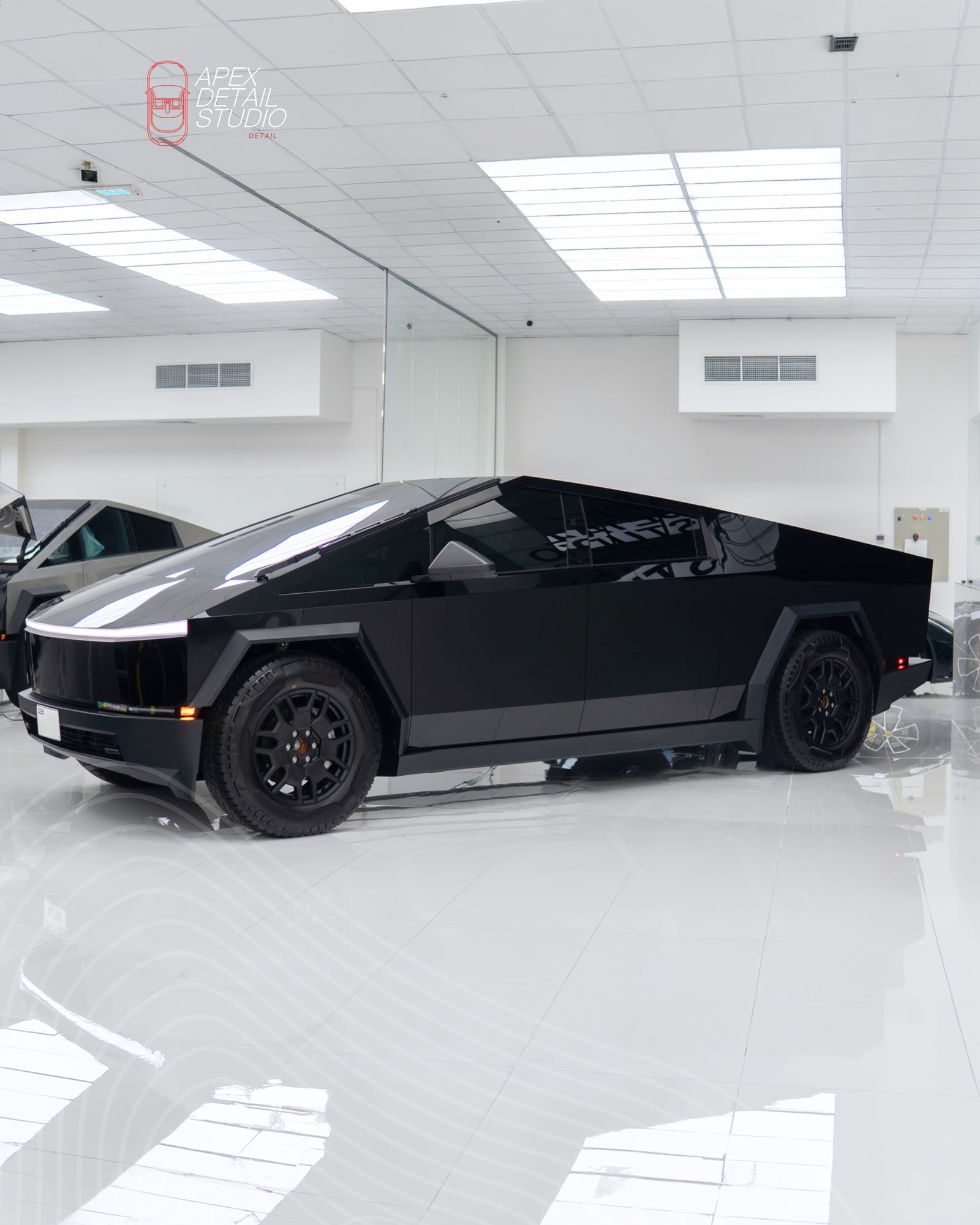 Black Tesla Cybertruck side profile at Apex Detail Studio Dubai