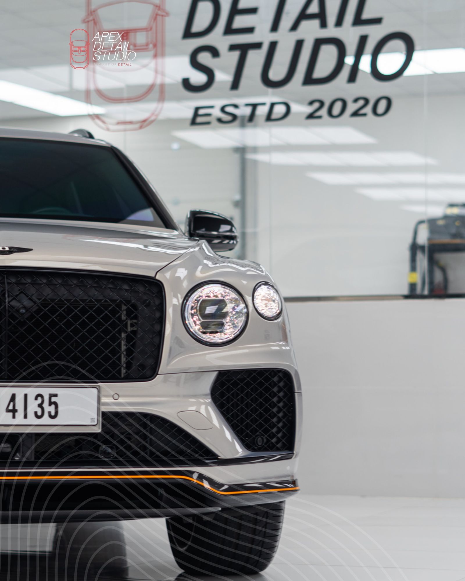 Front of a grey Bentley Bentayga in the studio at Apex Detail Studio Dubai