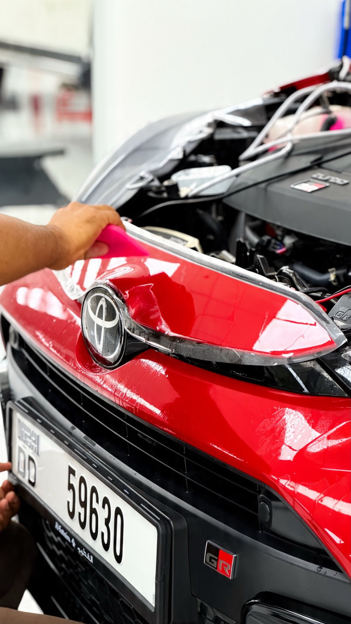 Engine bay being detailed at Apex Detail Studio Dubai