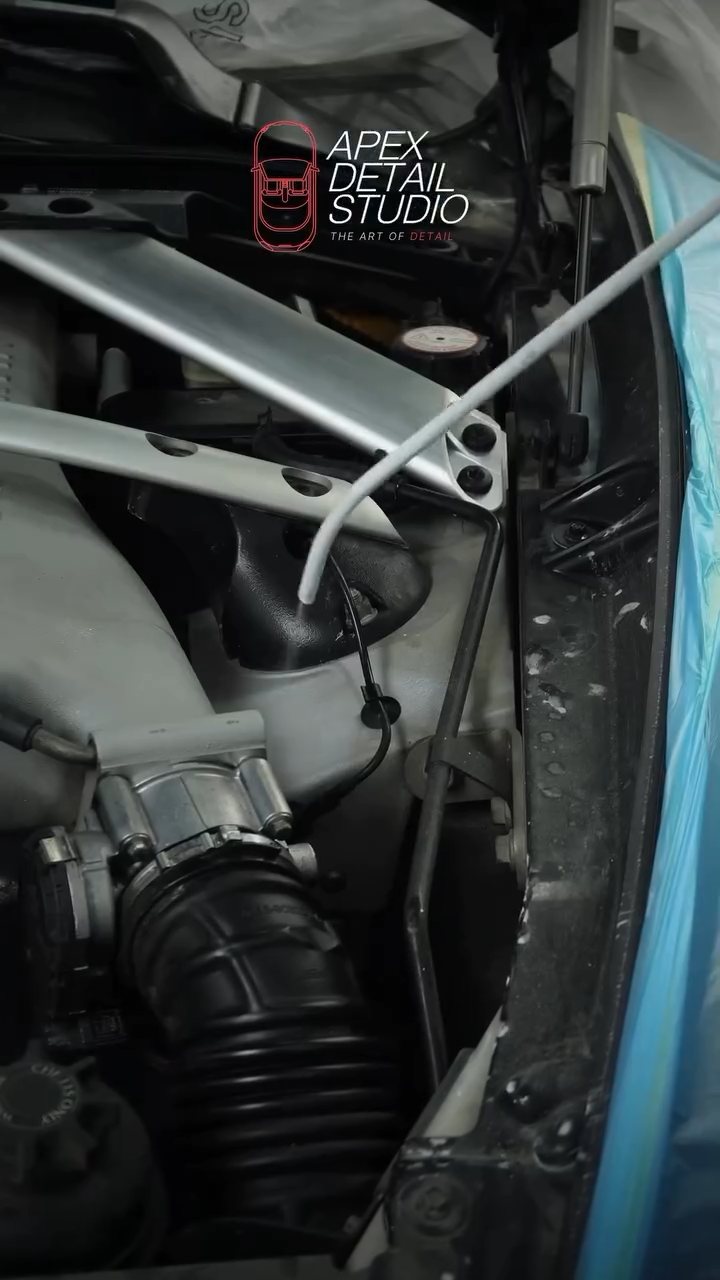 Aston Martin Rapide engine bay masked during dry ice cleaning in Dubai