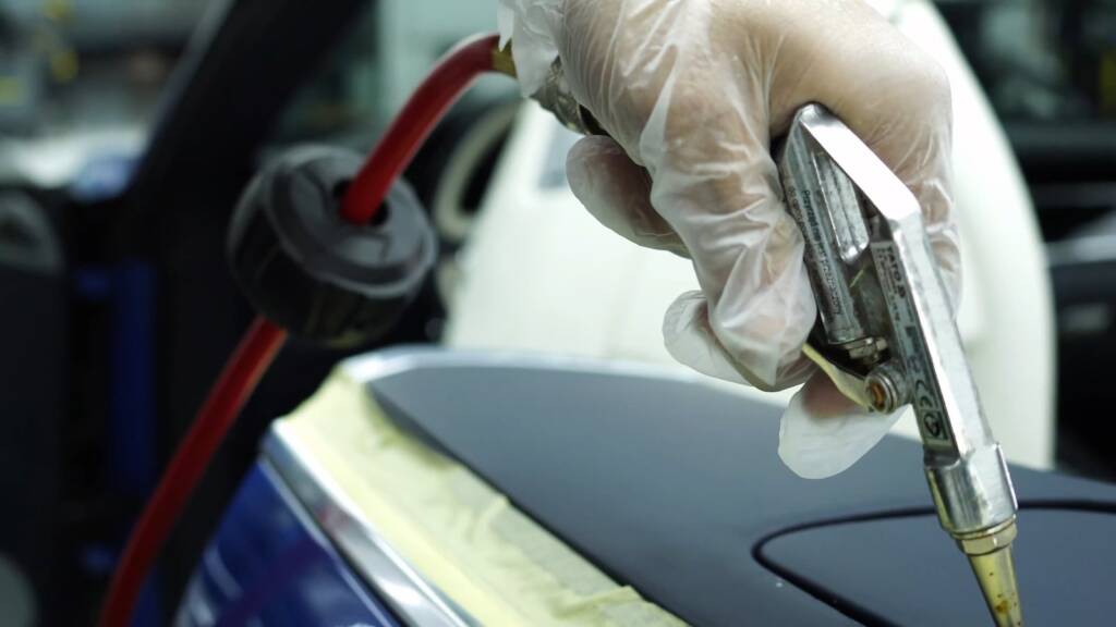 Air blowing a Bentley Continental GT trim panel dry