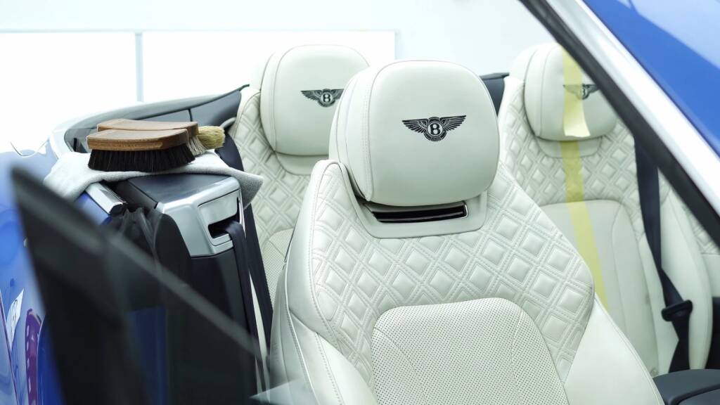 Front seats of a blue Bentley Continental GT convertible in Dubai