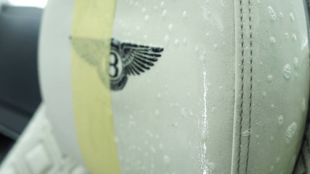 Cleaning the Bentley logo on a Continental GT headrest