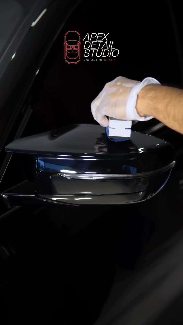 Ceramic coating applied around the black BMW headlight in Dubai