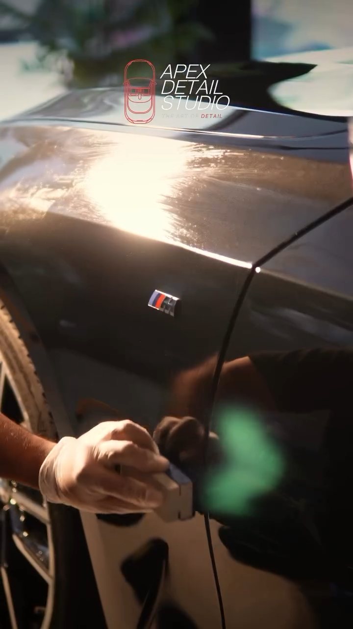 Panel wipe on the black BMW rear quarter before ceramic coating