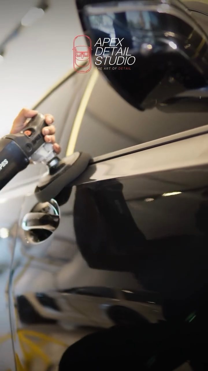 Polishing the black BMW door before Gtechniq coating in Dubai
