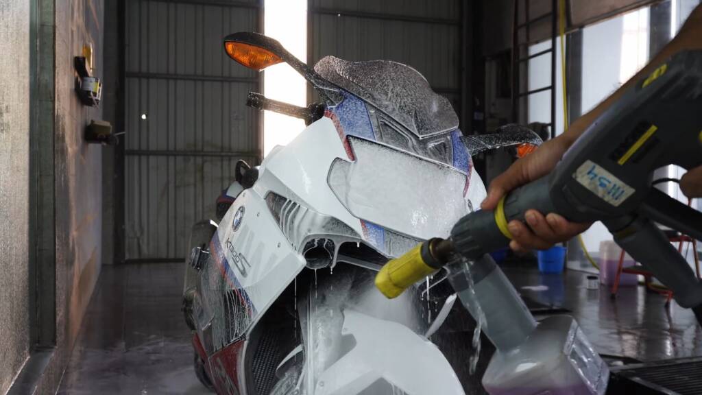 Foam washing a BMW K1300S motorcycle at Apex Detail Studio Dubai