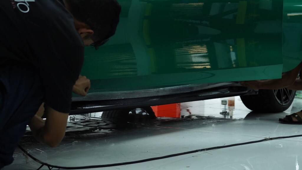 PPF edge along a BMW M3 Competition rear bumper