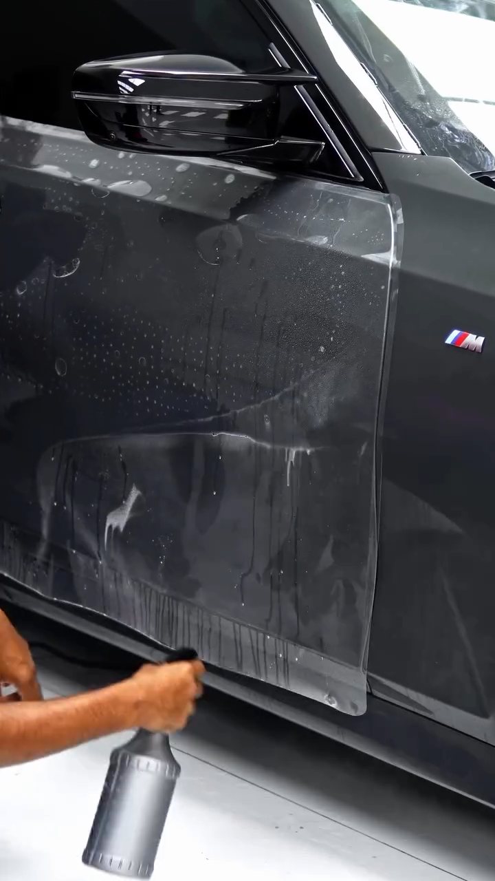Large PPF sheet laid on the BMW M340i bonnet in Dubai