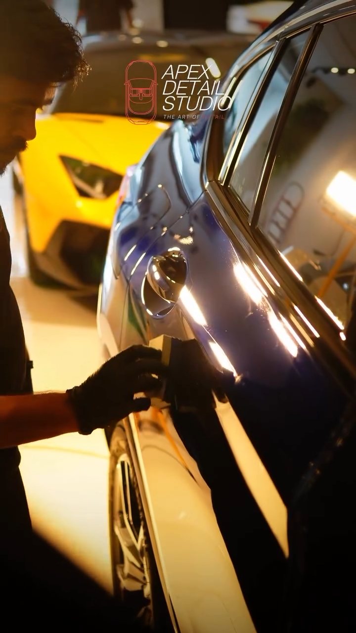BMW X4 door edge and handle area being coated at Apex Detail Studio Dubai