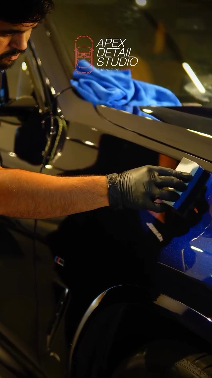 Buffing ceramic coating on the BMW X4 with a microfibre towel at Apex Detail Studio