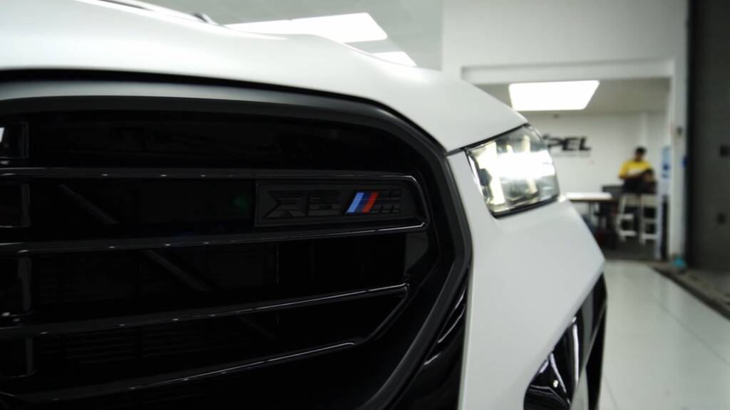 M badge on the 2024 BMW X6 M Competition kidney grille after PPF at Apex Detail Studio Dubai