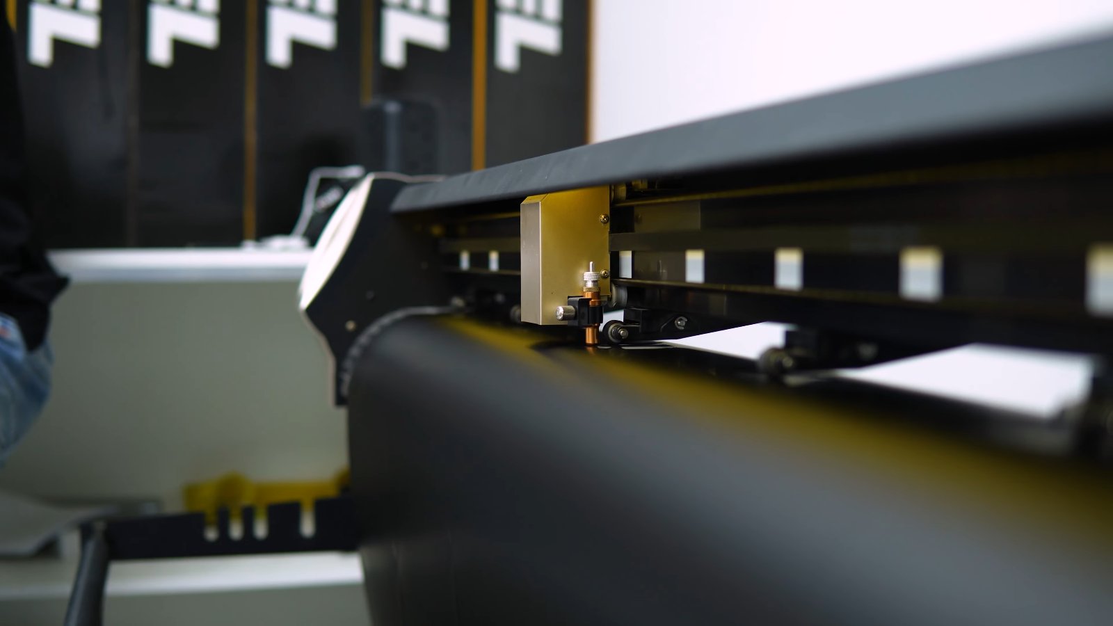 Satin black film coming off the plotter for a Tesla Cybertruck Cyberbeast