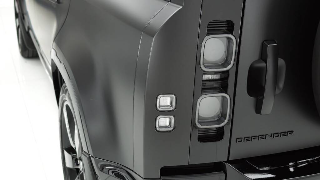 Rear lights and spare wheel of a satin Land Rover Defender 110, Apex Dubai