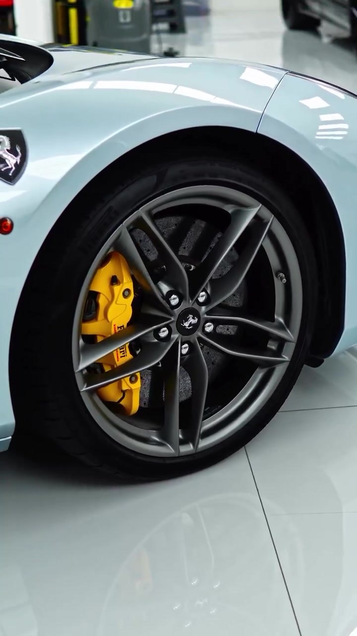 Ferrari 488 GTB wheel with yellow painted brake calipers at Apex Detail Studio