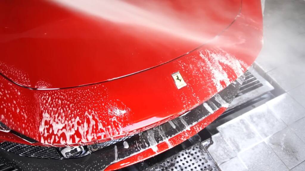 Rinsing the nose of a Ferrari Roma Spider
