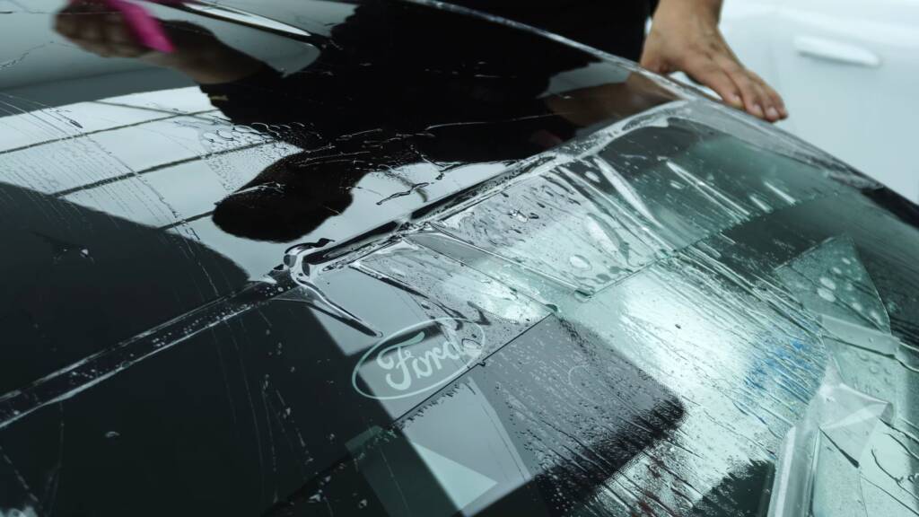 Positioning PPF across the 2024 Ford Mustang Dark Horse bonnet at Apex Detail Studio Dubai