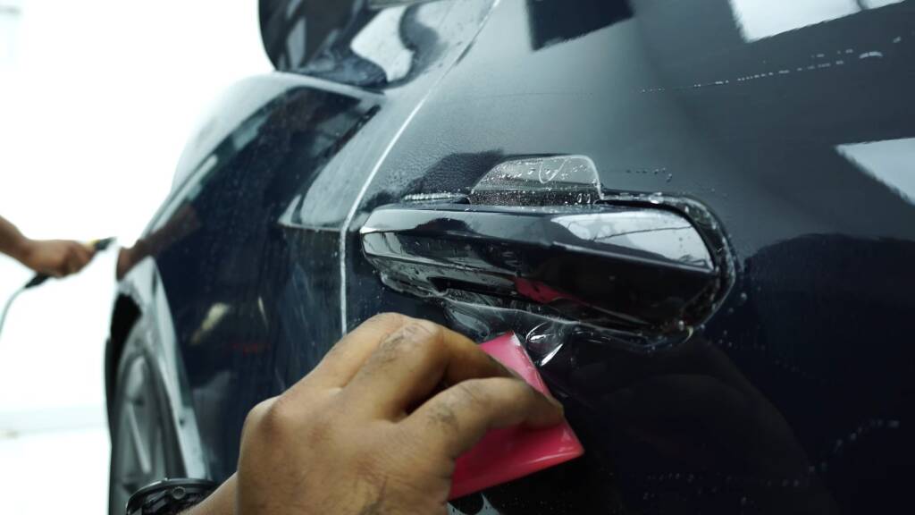 PPF worked around the 2024 Ford Mustang Dark Horse door handle at Apex Detail Studio Dubai