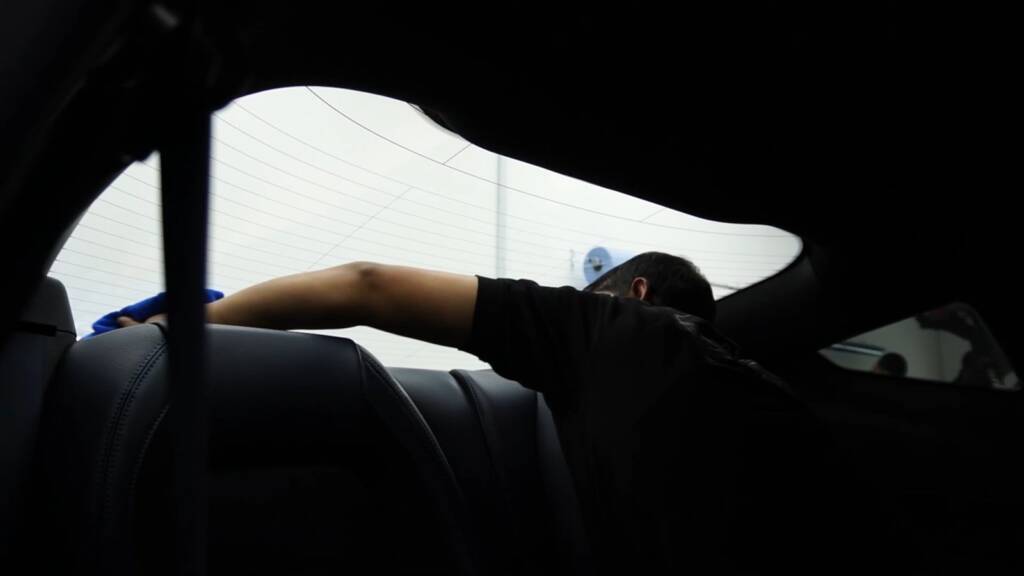 Tucking PPF edges inside the 2024 Ford Mustang Dark Horse door opening at Apex Detail Studio Dubai