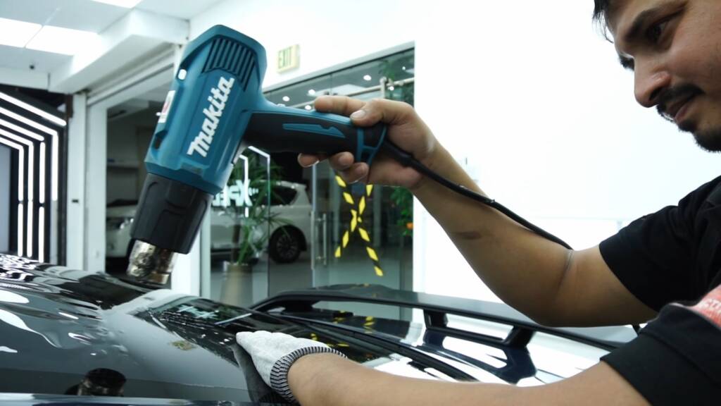 Heat gun setting PPF edges on the 2024 Ford Mustang Dark Horse at Apex Detail Studio Dubai