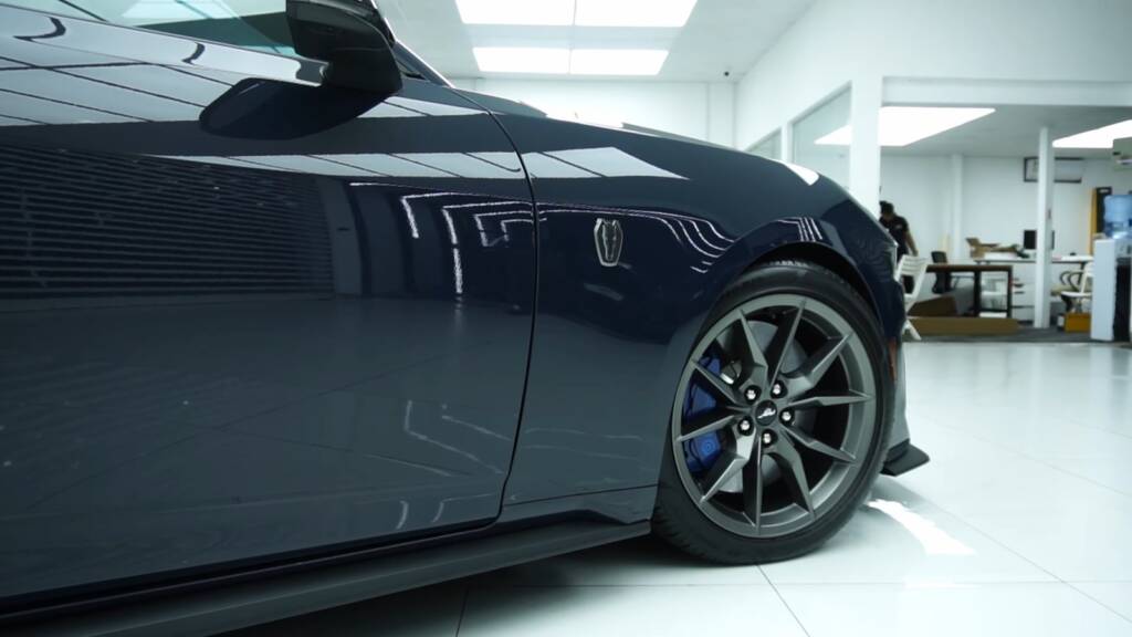 Finished 2024 Ford Mustang Dark Horse side and wheel with gloss PPF at Apex Detail Studio Dubai