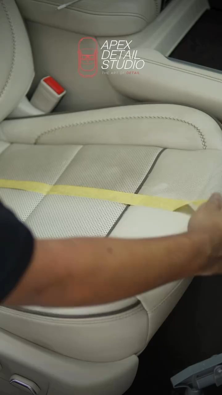 GMC Denali seat base with a tape line splitting cleaned and uncleaned leather in Dubai