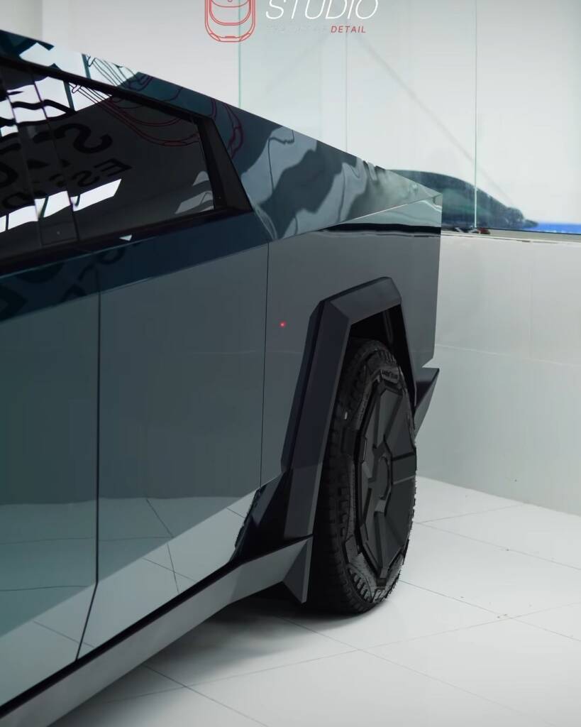 Close up of the green colour PPF on the side panel and wheel arch of a Tesla Cybertruck in Dubai