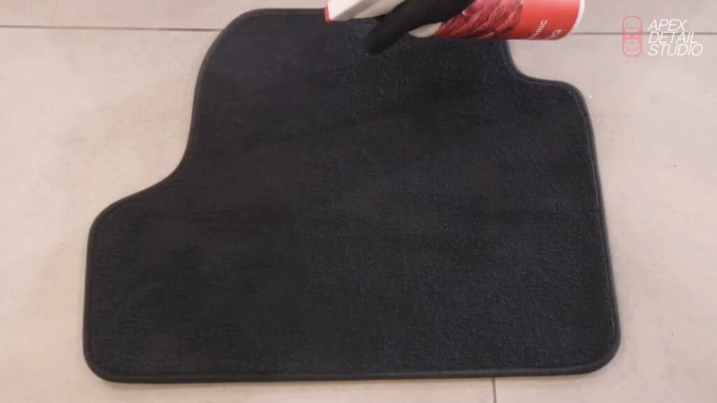 Gtechniq Smart Fabric being sprayed onto a car floor mat at Apex Detail Studio Dubai