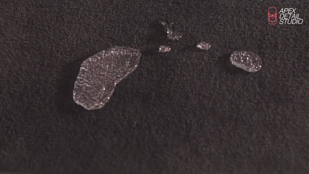Water beading on car carpet protected with Gtechniq Smart Fabric at Apex Detail Studio Dubai