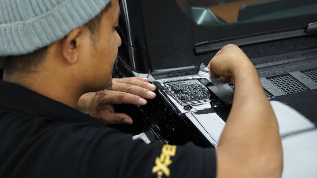 Paint protection film being fitted on Jetour G700 bumper detail in Dubai