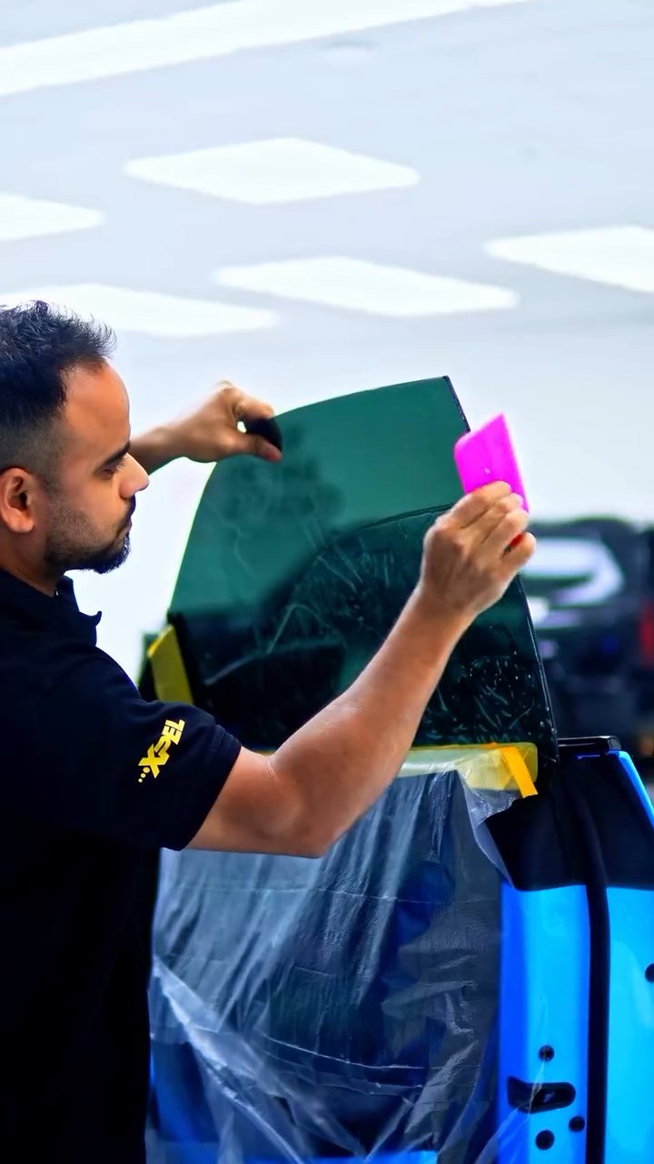 Apex installer fitting window tint to the Lamborghini Urus Performante at Apex Detail Studio Dubai