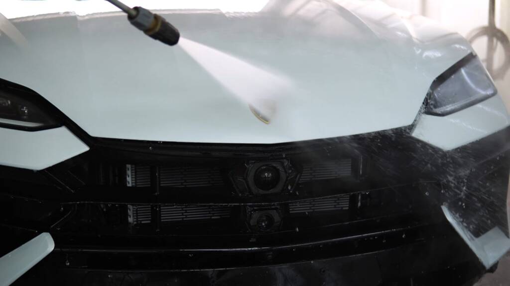 White Lamborghini Urus SE being washed before PPF at Apex Detail Studio Dubai
