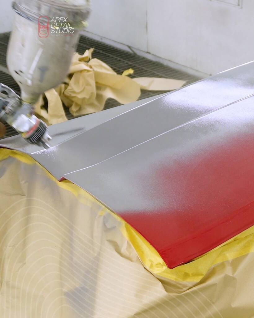 Lancia Delta Integrale boot lid being sprayed in the paint booth at Apex Detail Studio Dubai