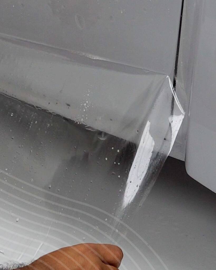 Close up of PPF tucked at the door edge of the Nardo Grey Lancia Delta Integrale at Apex Detail Studio Dubai