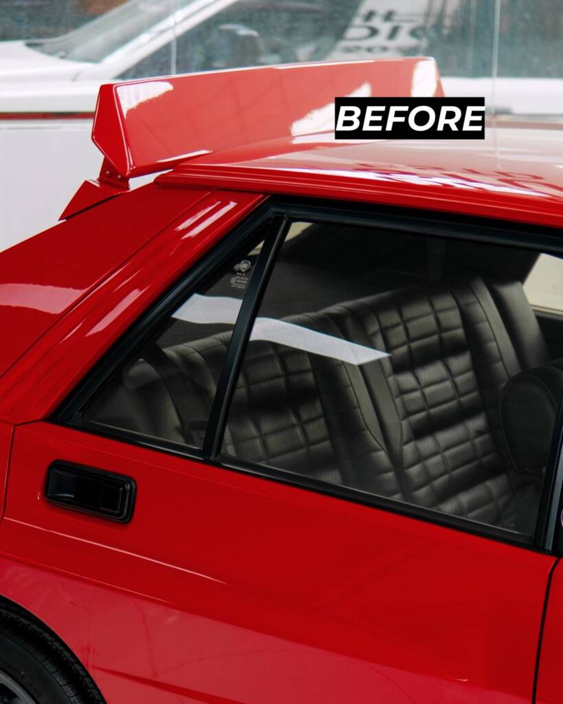 Roof spoiler and rear glass of the red Lancia Delta Integrale before paint at Apex Detail Studio Dubai