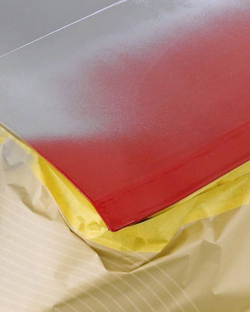 Red to Nardo Grey colour change on a Lancia Delta Integrale panel in the booth at Apex Detail Studio Dubai