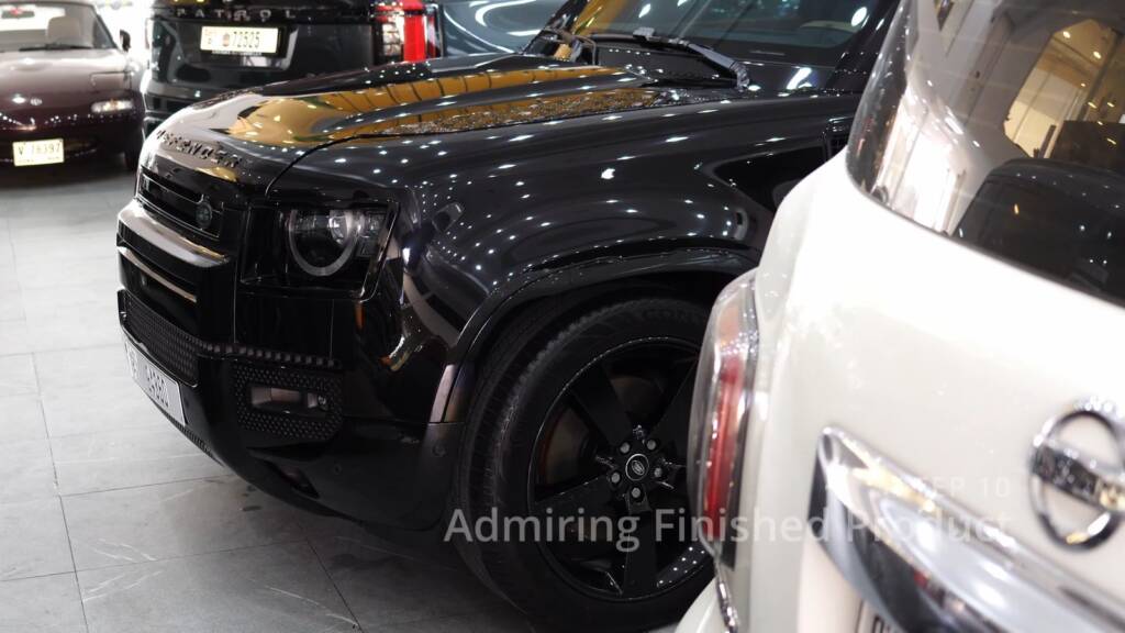 Black Land Rover Defender 130 front after premium PPF in Dubai