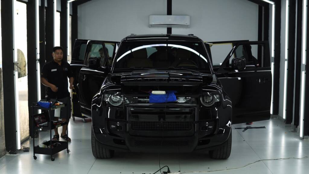 Black 2024 Land Rover Defender 130 in the Apex studio before premium PPF