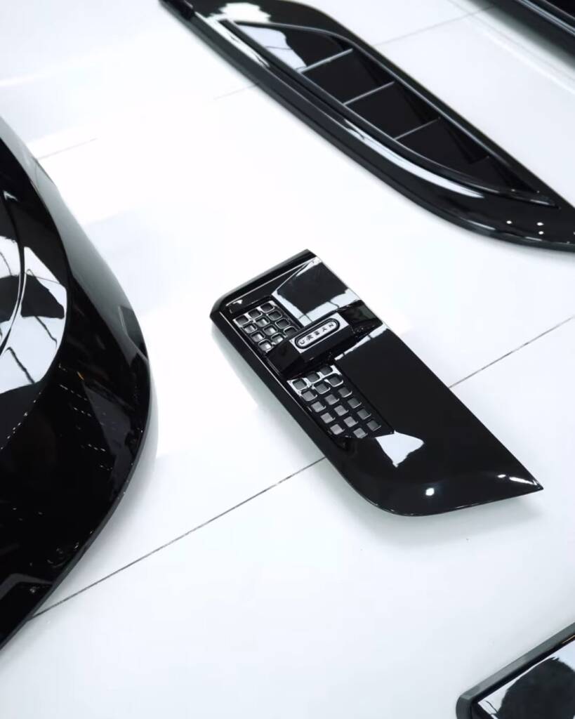 Gloss black Defender body kit parts close up, Apex Detail Studio Dubai