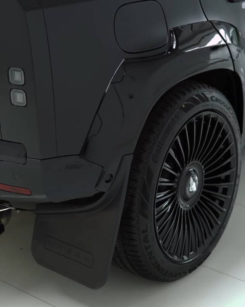 Side view of black edition wheel and arch on a finished Defender body kit, Dubai