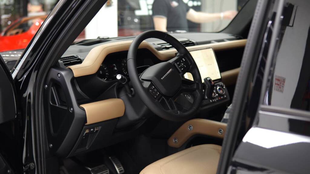Interior of a 2026 Land Rover Defender with tan leather at Apex Detail Studio