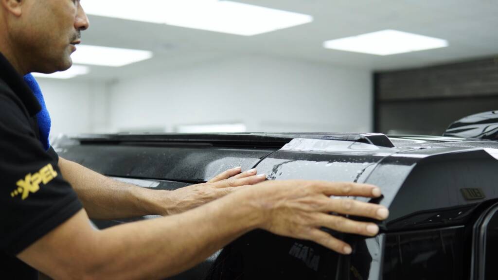 Panel preparation on a 2026 Land Rover Defender before PPF, Dubai