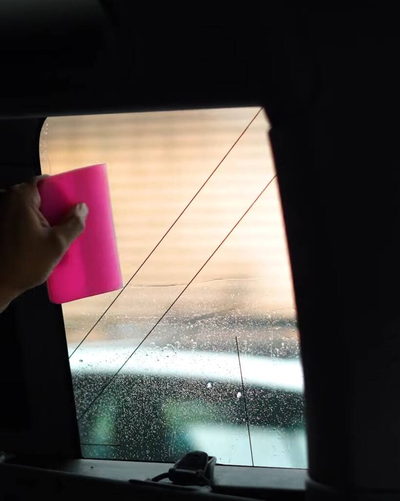 Tint film positioned on Land Rover Defender glass, seen from inside the cabin