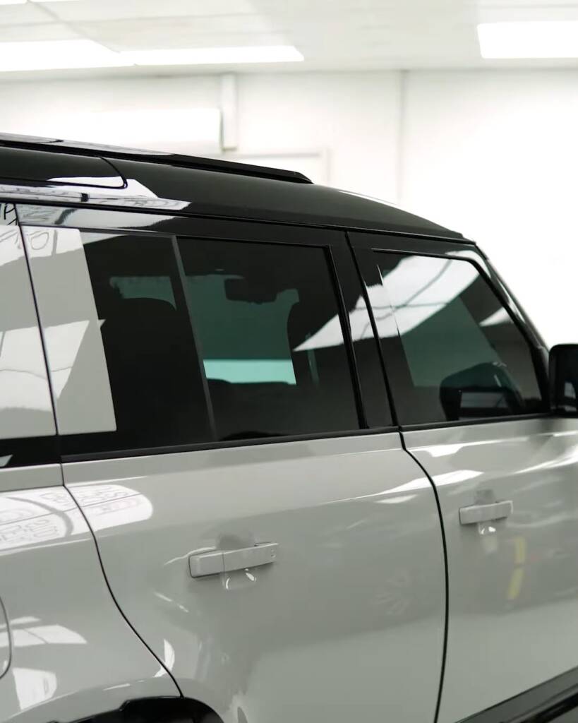 Side of a 2026 Land Rover Defender with tinted windows, Apex Detail Studio