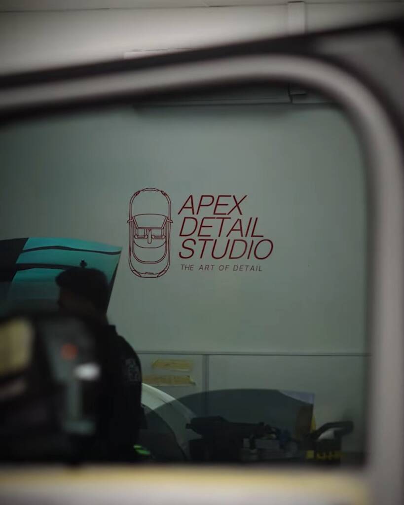 Tinted door glass seen from inside a 2026 Land Rover Defender at Apex Dubai