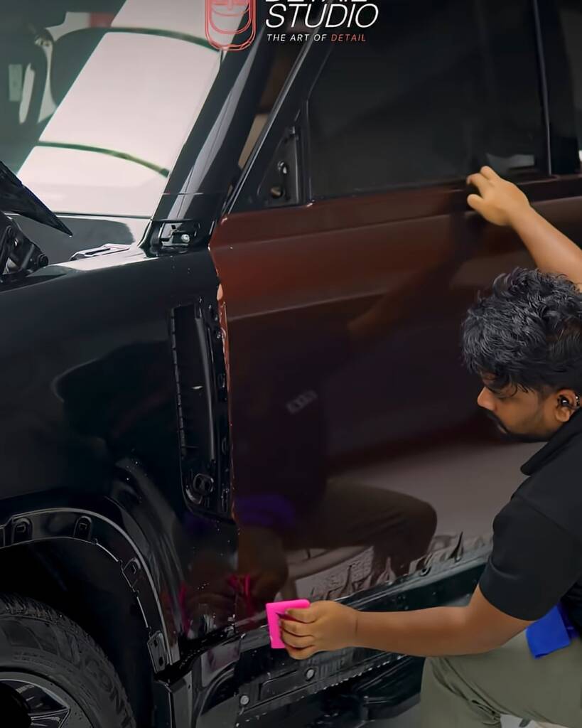 Edge work on Sedona Red colour PPF at the lower door of a Defender, Dubai