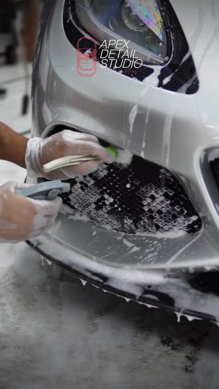 Detailing brush cleaning the Lotus Exige front grille in Dubai