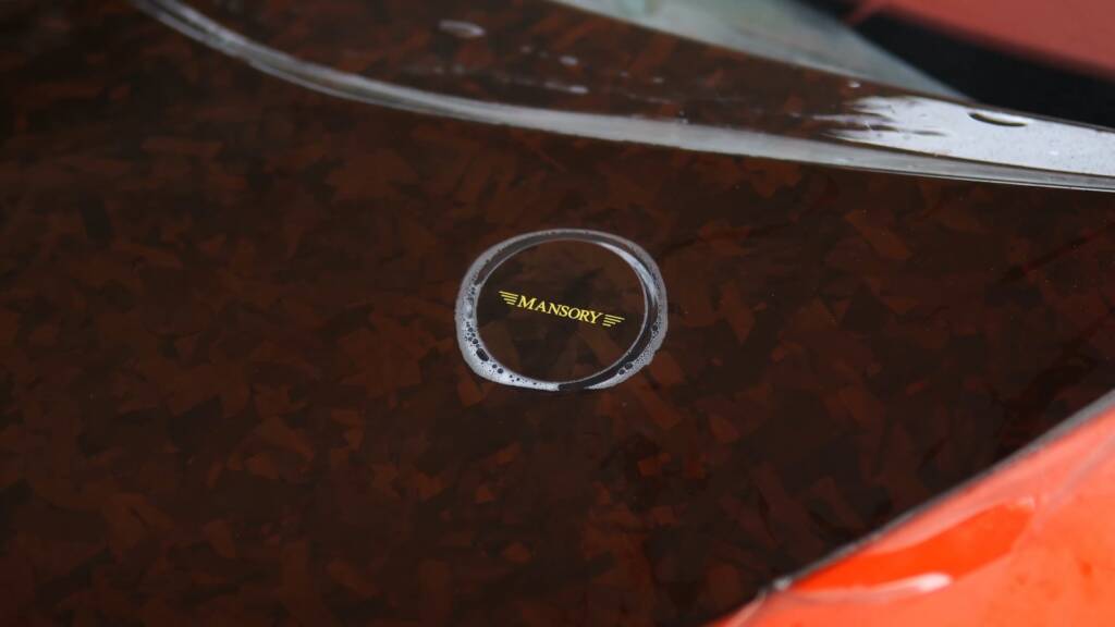 Mansory badge on a forged carbon bonnet before PPF